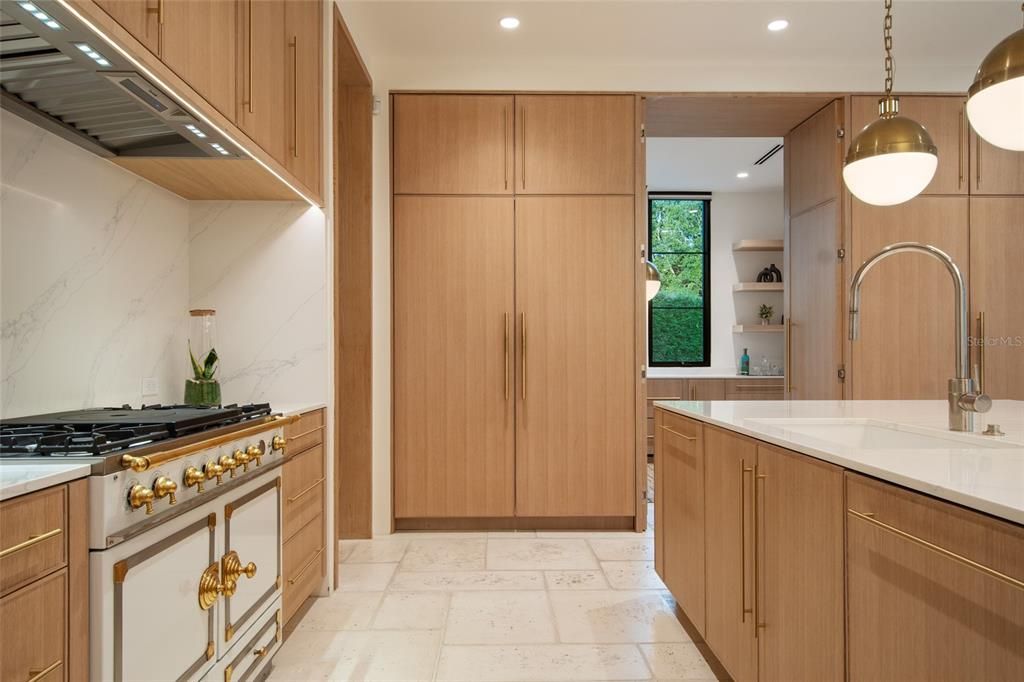 Interior, Kitchen, Marble Walls, Pendant Lights, Recessed Lighting, Stainless Steel Appliances