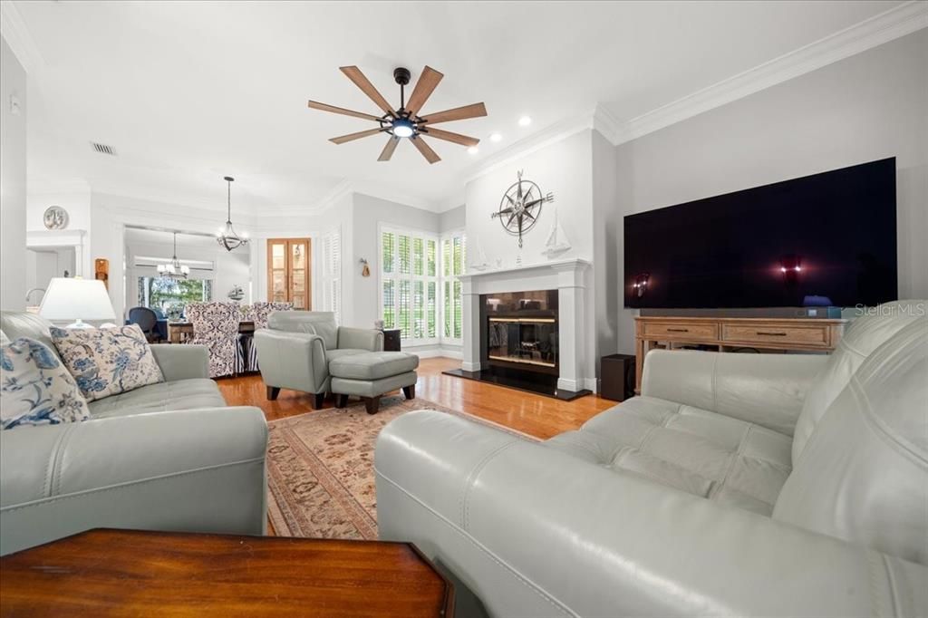 Dining room, Fireplace, Interior, Living room, Pendant Lights, Recessed Lighting, Wood Texture Flooring