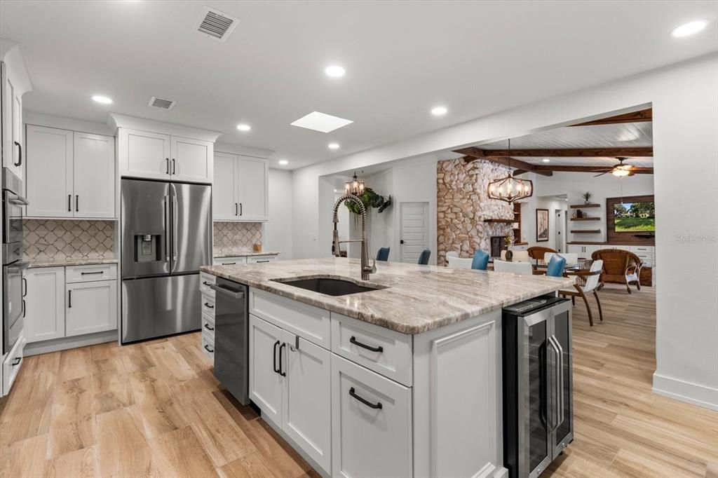 Dining room, Interior, Kitchen, Pendant Lights, Recessed Lighting, Stainless Steel Appliances, Stone Walls, Wood Texture Flooring