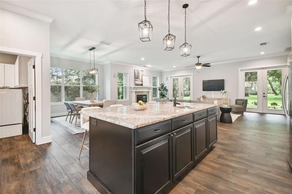 Dining room, Fireplace, Interior, Kitchen, Pendant Lights, Recessed Lighting, Wood Texture Flooring