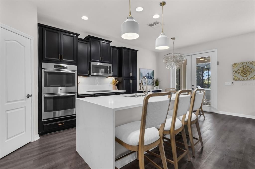 Chandelier, Interior, Kitchen, Pendant Lights, Recessed Lighting, Stainless Steel Appliances, Wood Texture Flooring