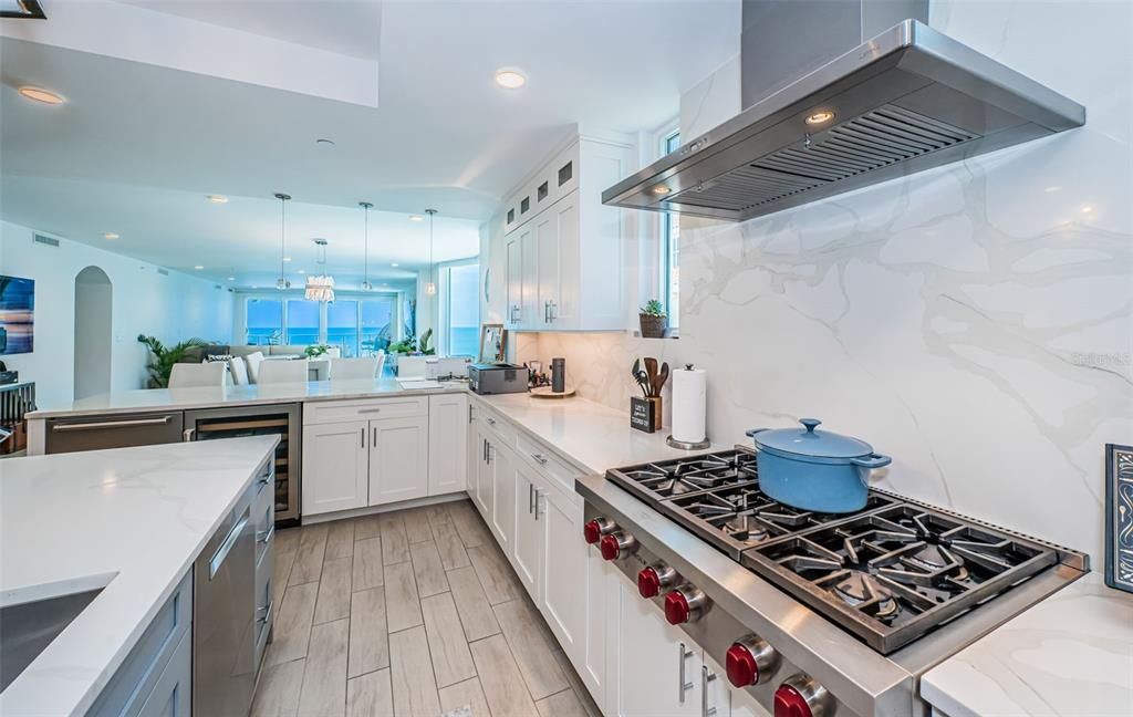 Interior, Kitchen, Marble Walls, Pendant Lights, Recessed Lighting, Stainless Steel Appliances, Wood Texture Flooring
