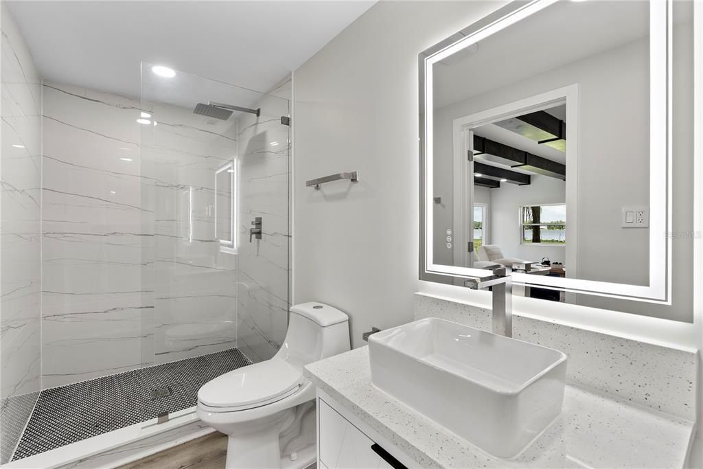 Bathroom, Glass Shower, Interior, Marble Walls, Recessed Lighting, Wood Texture Flooring