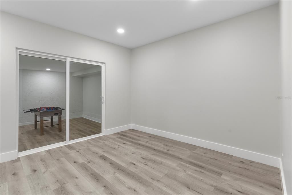 Empty room, Game Room, Interior, Recessed Lighting, Wood Texture Flooring