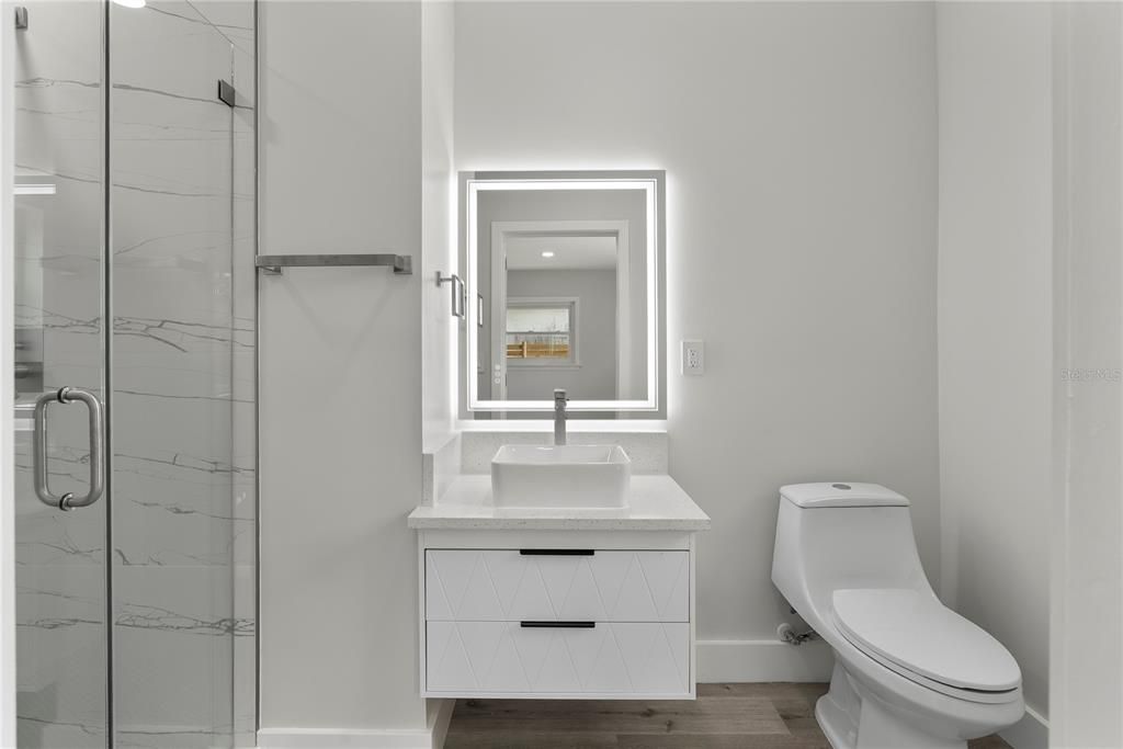 Bathroom, Glass Shower, Interior, Marble Walls, Recessed Lighting, Wood Texture Flooring