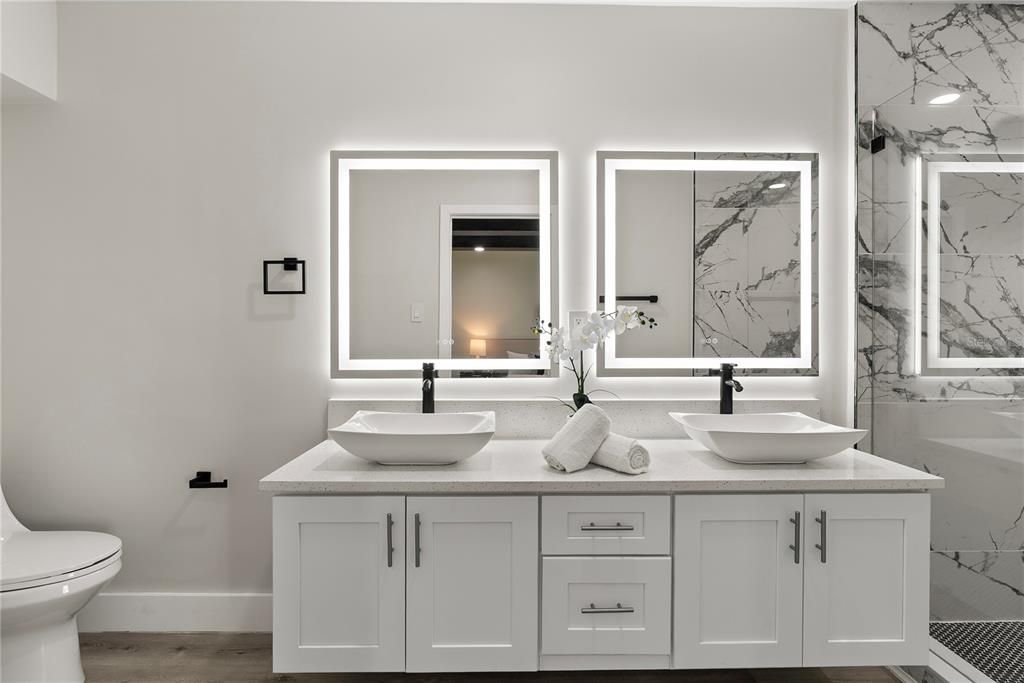 Bathroom, Dual Sink Vanities, Interior, Marble Walls, Wood Texture Flooring