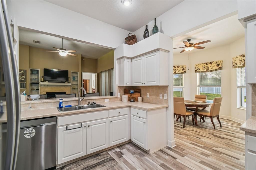 Dining room, Fireplace, Interior, Kitchen, Recessed Lighting, Wood Texture Flooring
