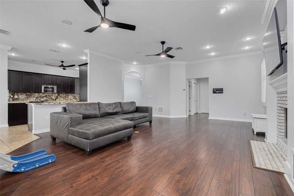 Fireplace, Interior, Kitchen, Living room, Recessed Lighting, Wood Texture Flooring