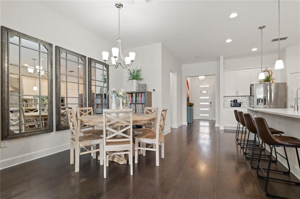 Chandelier, Dining room, Interior, Kitchen, Pendant Lights, Recessed Lighting, Stainless Steel Appliances, Wood Texture Flooring