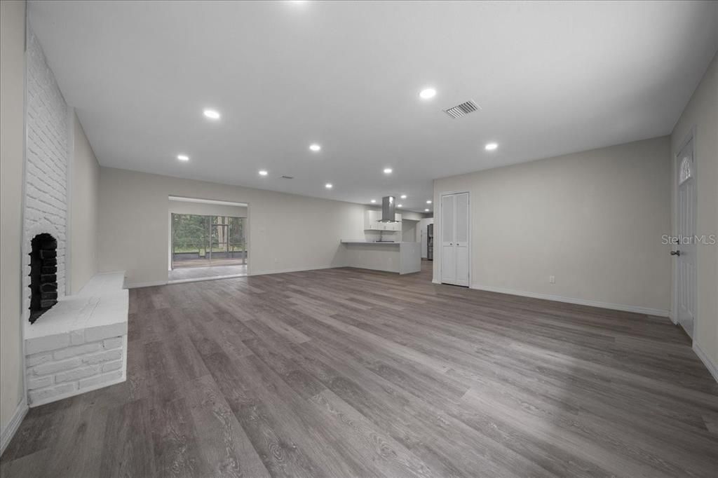 Empty room, Fireplace, Interior, Pendant Lights, Recessed Lighting, Wood Texture Flooring