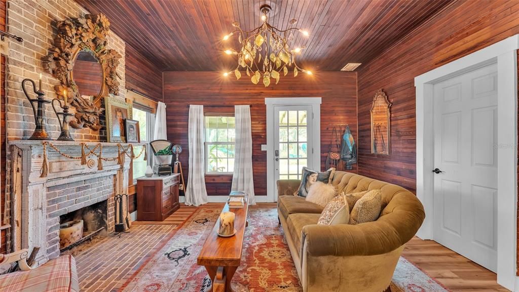 Chandelier, Fireplace, Interior, Living room, Recessed Lighting, Stone Walls, Wooden Ceilings, Wood Texture Flooring, Wooden Walls