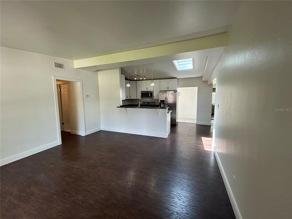 Empty room, Interior, Kitchen, Stainless Steel Appliances, Wood Texture Flooring