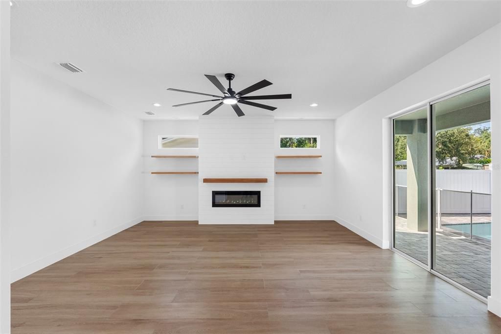Empty room, Fireplace, Interior, Recessed Lighting, Wood Texture Flooring