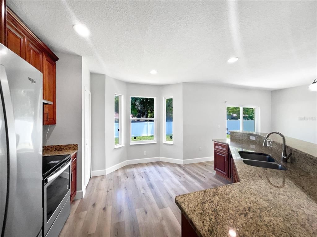 Interior, Kitchen, Recessed Lighting, Stainless Steel Appliances, Water, Wood Texture Flooring