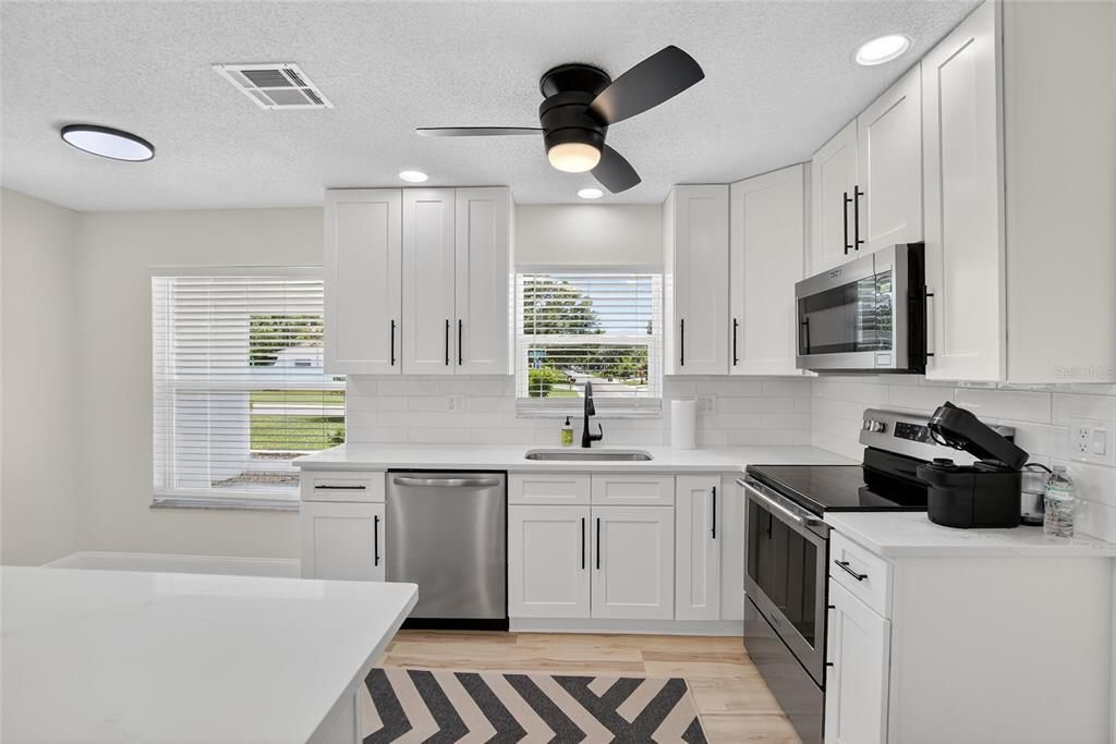 Interior, Kitchen, Recessed Lighting, Stainless Steel Appliances, Wood Texture Flooring