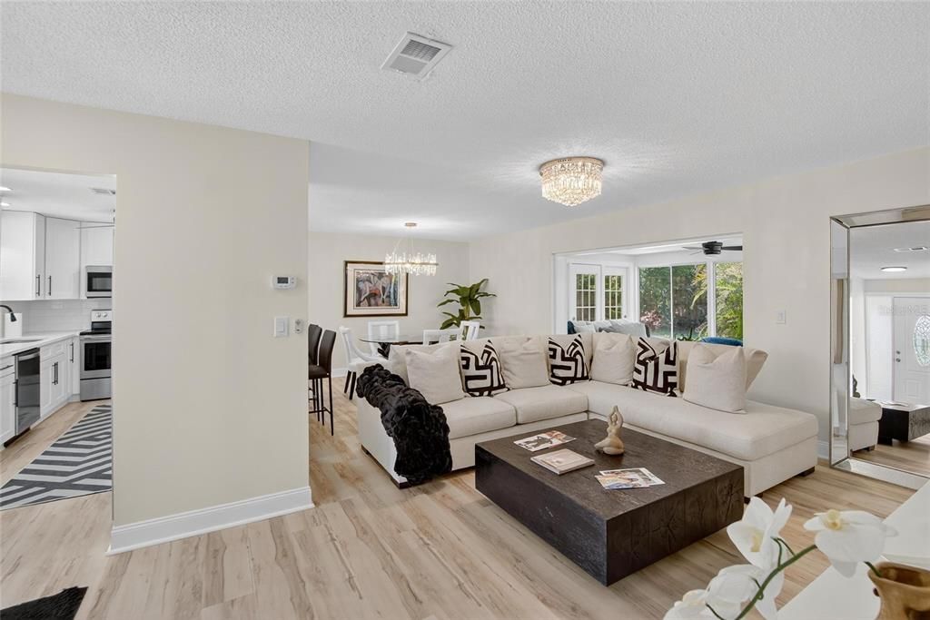 Chandelier, Dining room, Interior, Kitchen, Living room, Recessed Lighting, Wood Texture Flooring