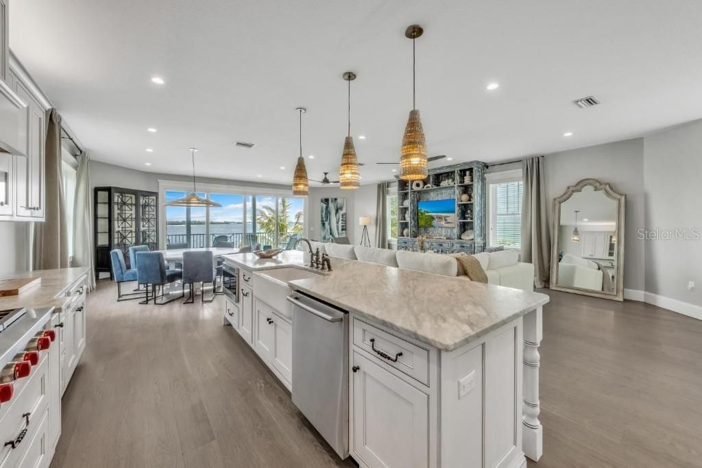 Dining room, Interior, Kitchen, Living room, Pendant Lights, Recessed Lighting, Stainless Steel Appliances, Wood Texture Flooring