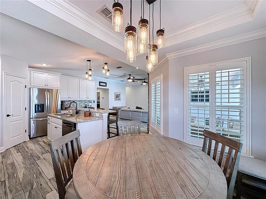 Dining room, Interior, Kitchen, Pendant Lights, Recessed Lighting, Stainless Steel Appliances, Wood Texture Flooring