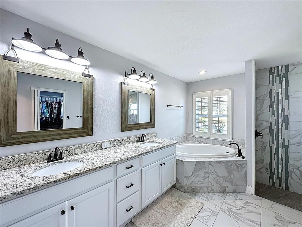 Bathroom, Dual Sink Vanities, Glass Shower, Interior, Marble, Marble Walls, Recessed Lighting