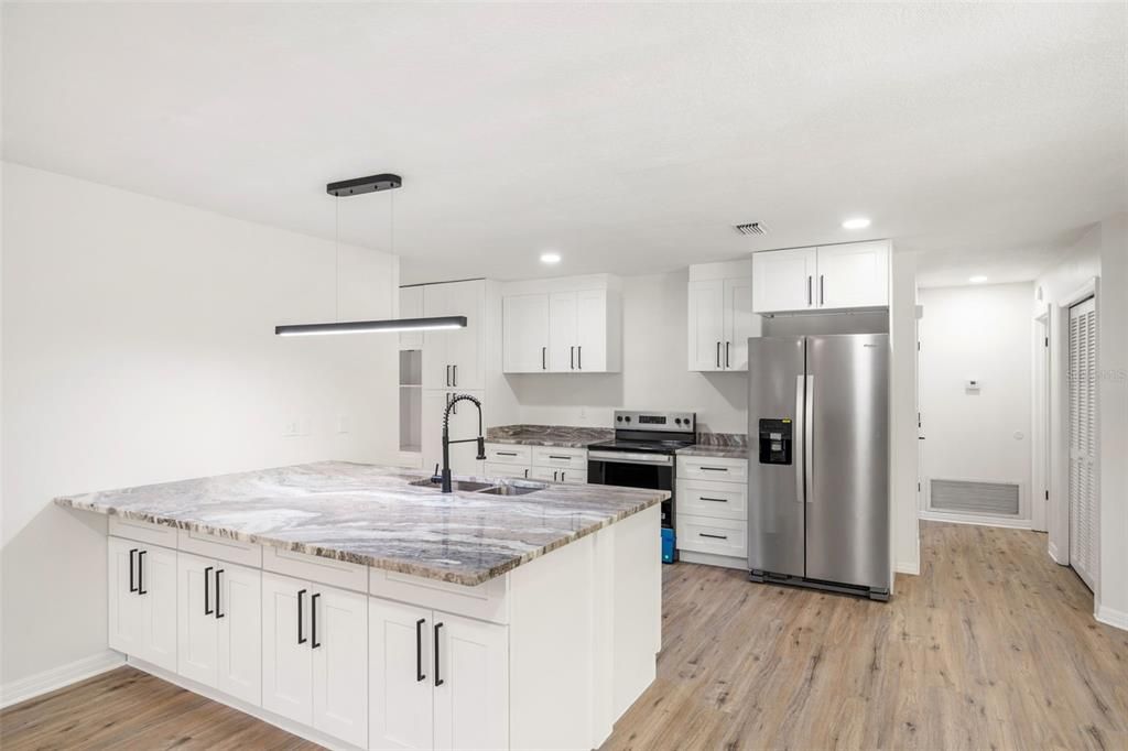 Interior, Kitchen, Pendant Lights, Recessed Lighting, Stainless Steel Appliances, Wood Texture Flooring