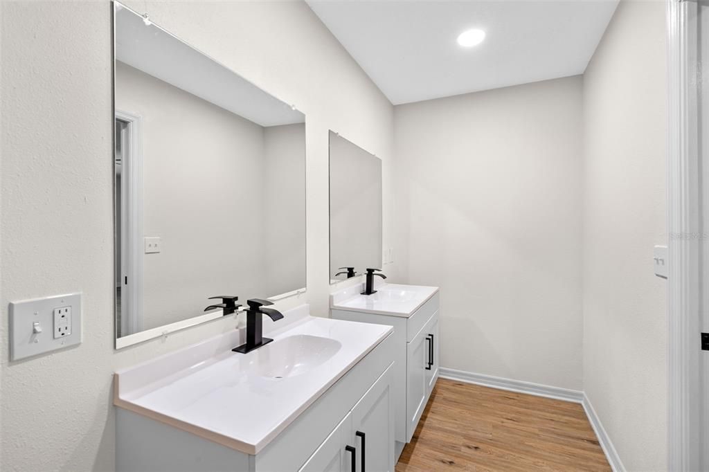 Bathroom, Dual Sink Vanities, Interior, Recessed Lighting, Wood Texture Flooring