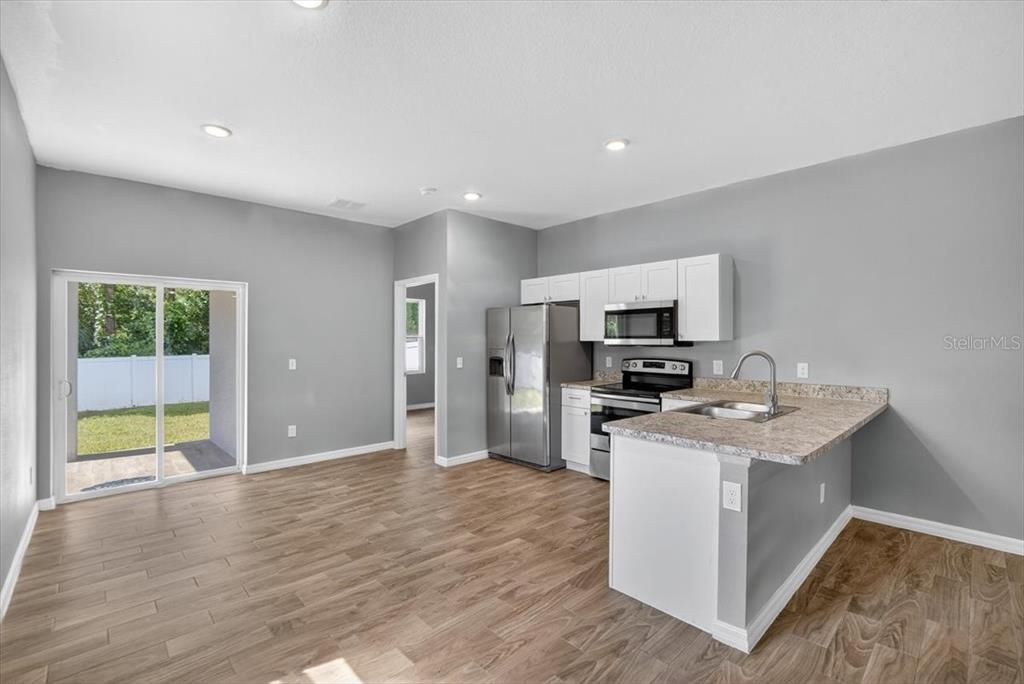 Interior, Kitchen, Recessed Lighting, Stainless Steel Appliances, Wood Texture Flooring