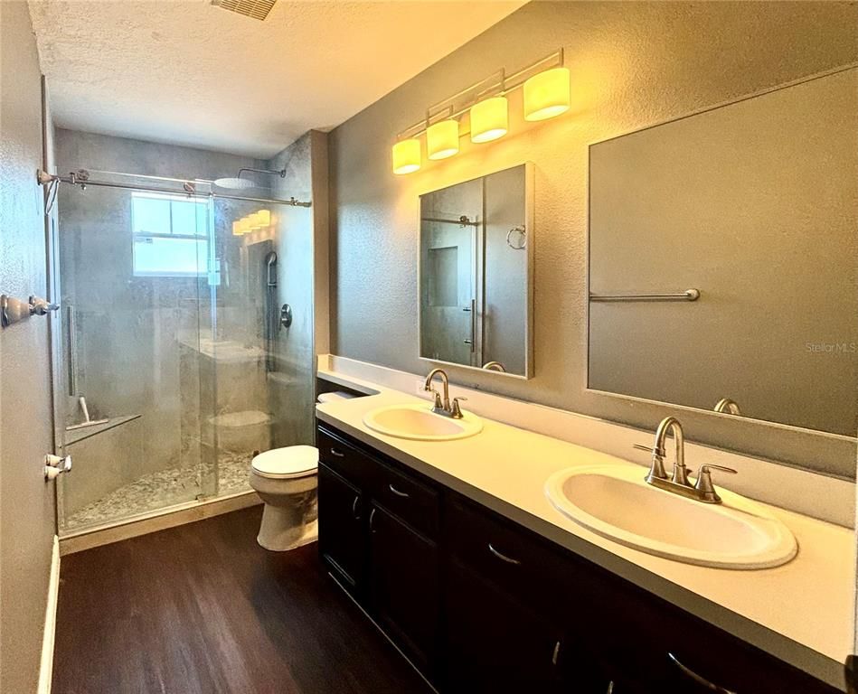 Bathroom, Dual Sink Vanities, Glass Shower, Interior, Wood Texture Flooring