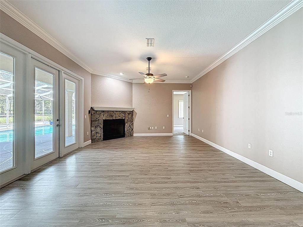 Empty room, Fireplace, Interior, Recessed Lighting, Wood Texture Flooring