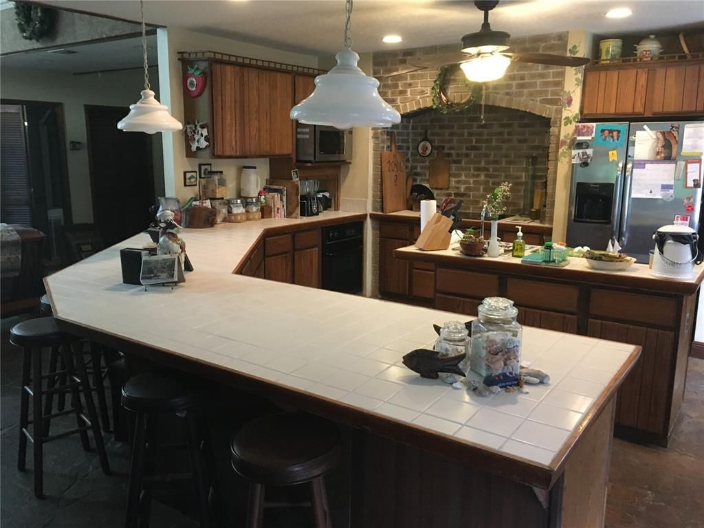 Interior, Kitchen, Pendant Lights, Recessed Lighting, Stone Walls, Tile Countertops