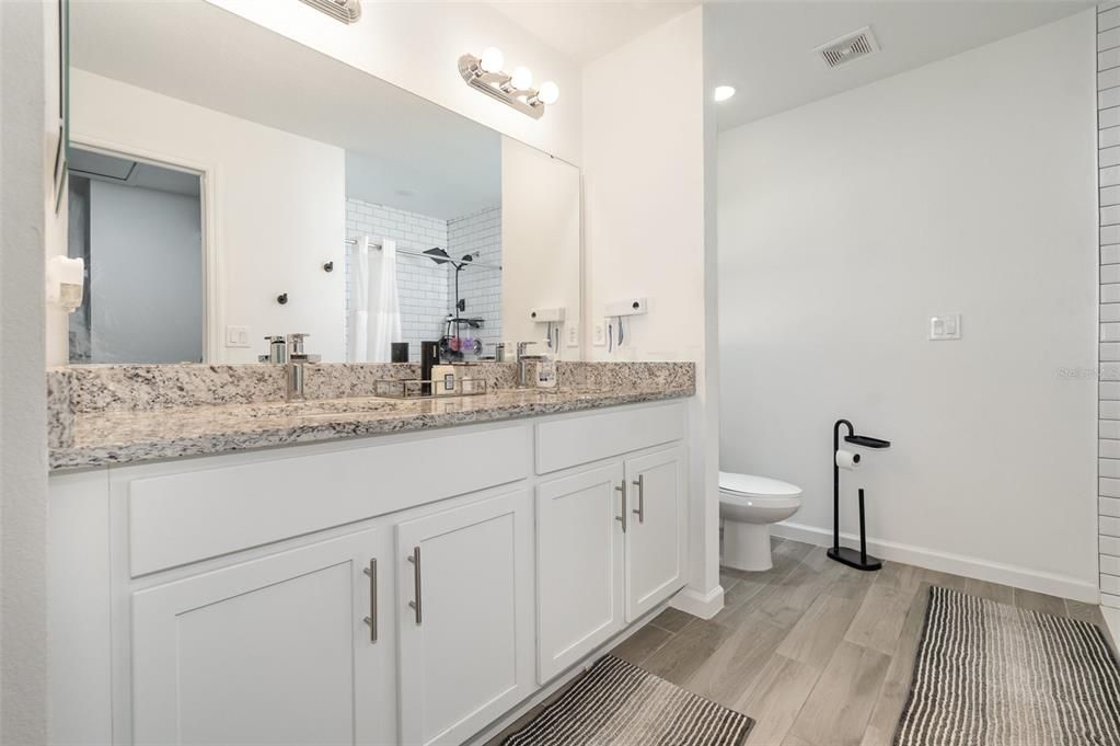 Bathroom, Dual Sink Vanities, Interior, Recessed Lighting, Wood Texture Flooring