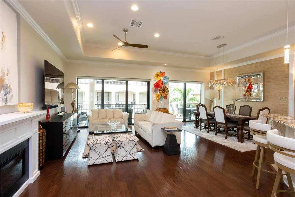 Dining room, Fireplace, Interior, Living room, Pendant Lights, Recessed Lighting, Wood Texture Flooring