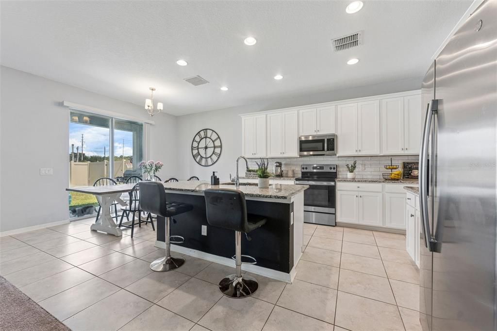 Chandelier, Dining room, Interior, Kitchen, Recessed Lighting, Stainless Steel Appliances