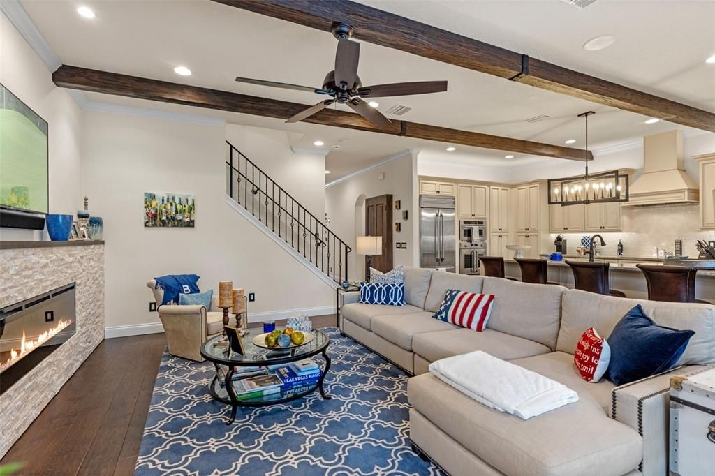 Fireplace, Interior, Kitchen, Living room, Pendant Lights, Recessed Lighting, Stainless Steel Appliances, Wood Texture Flooring