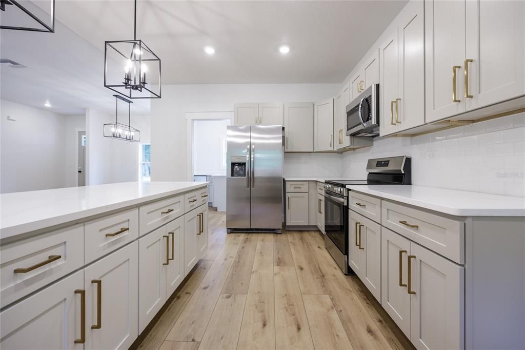 Interior, Kitchen, Pendant Lights, Recessed Lighting, Stainless Steel Appliances, Wood Texture Flooring