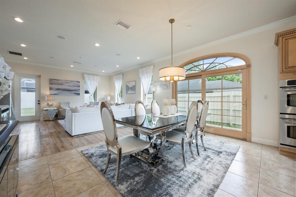 Dining room, Interior, Living room, Pendant Lights, Recessed Lighting, Stainless Steel Appliances, Wood Texture Flooring