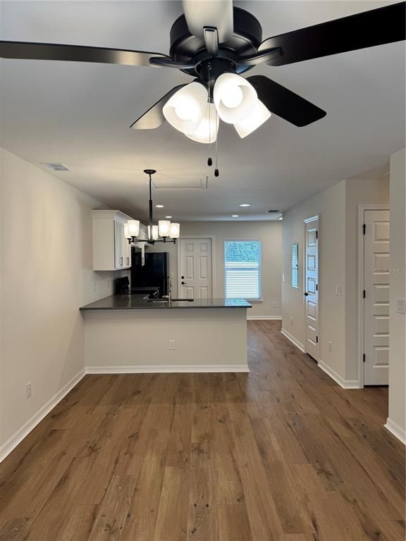Chandelier, Empty room, Interior, Kitchen, Recessed Lighting, Wood Texture Flooring