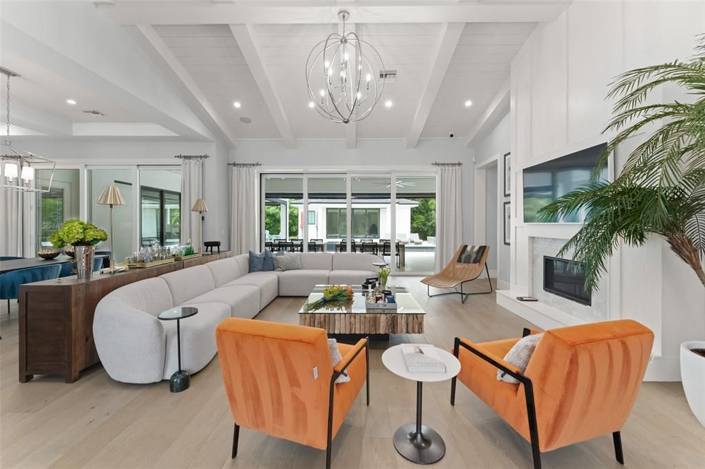 Chandelier, Fireplace, Interior, Living room, Pendant Lights, Recessed Lighting, Wood Texture Flooring