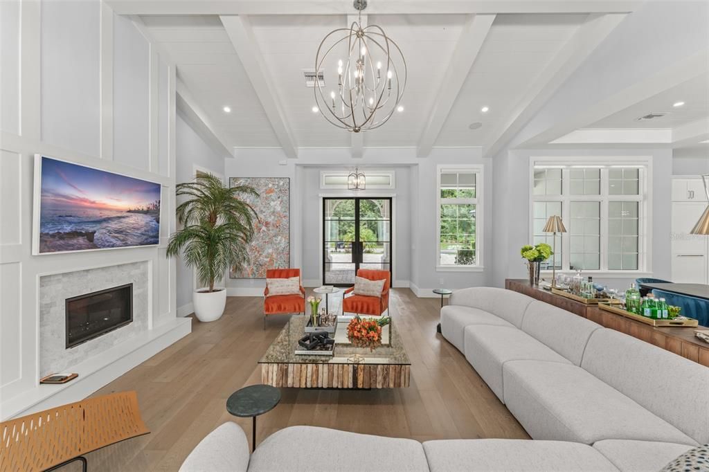 Chandelier, Fireplace, Interior, Living room, Recessed Lighting, Wood Texture Flooring