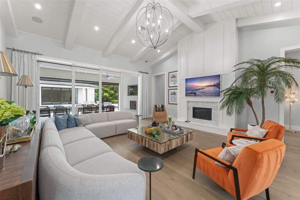 Chandelier, Dining room, Fireplace, Interior, Living room, Recessed Lighting, Wood Texture Flooring