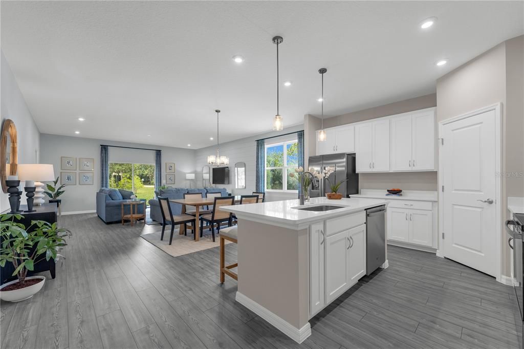 Chandelier, Dining room, Interior, Kitchen, Living room, Pendant Lights, Recessed Lighting, Stainless Steel Appliances, Wood Texture Flooring