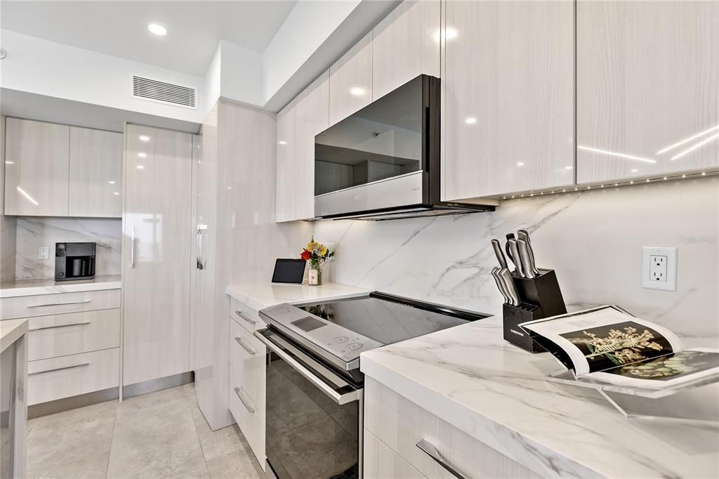 Interior, Kitchen, Marble Walls, Recessed Lighting, Stainless Steel Appliances
