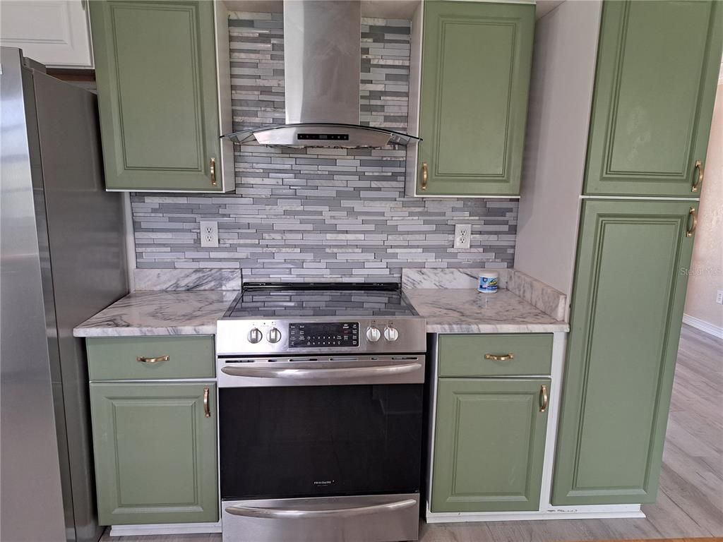 Interior, Kitchen, Marble Walls, Stainless Steel Appliances, Wood Texture Flooring