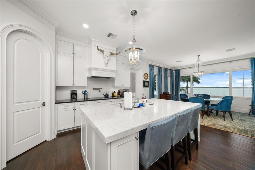 Chandelier, Dining room, Interior, Kitchen, Pendant Lights, Recessed Lighting, Water, Wood Texture Flooring