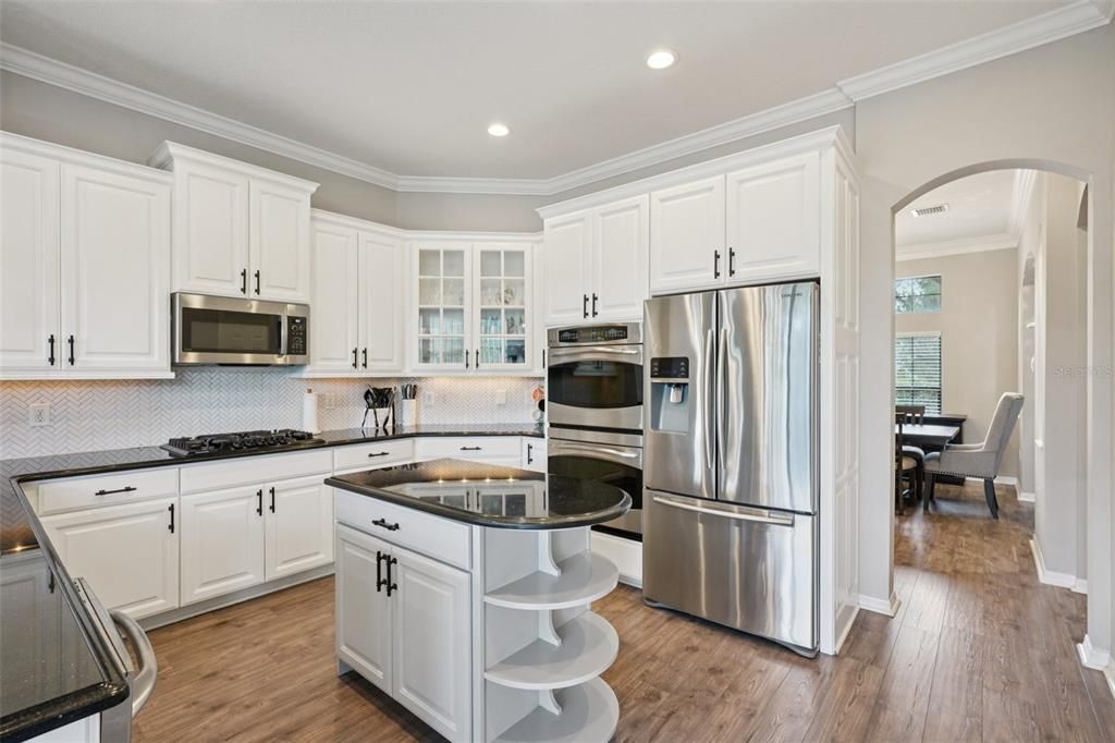 Dining room, Interior, Kitchen, Recessed Lighting, Stainless Steel Appliances, Wood Texture Flooring
