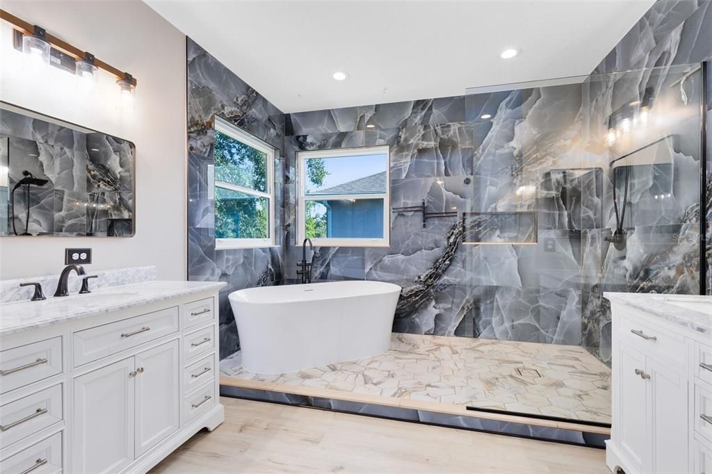 Bathroom, Dual Sink Vanities, Free Standing Baths, Interior, Marble Walls, Recessed Lighting, Wood Texture Flooring
