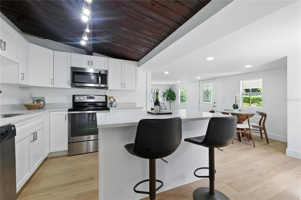 Dining room, Interior, Kitchen, Recessed Lighting, Stainless Steel Appliances, Wooden Ceilings, Wood Texture Flooring