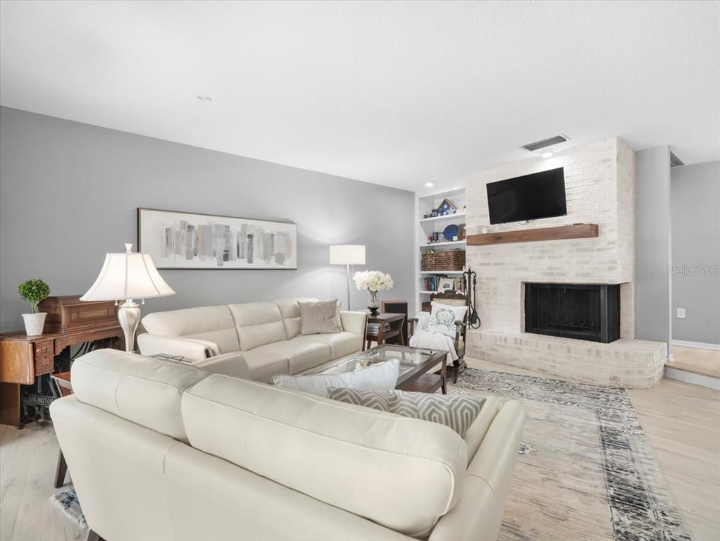 Fireplace, Interior, Living room, Recessed Lighting, Stone Walls, Wood Texture Flooring