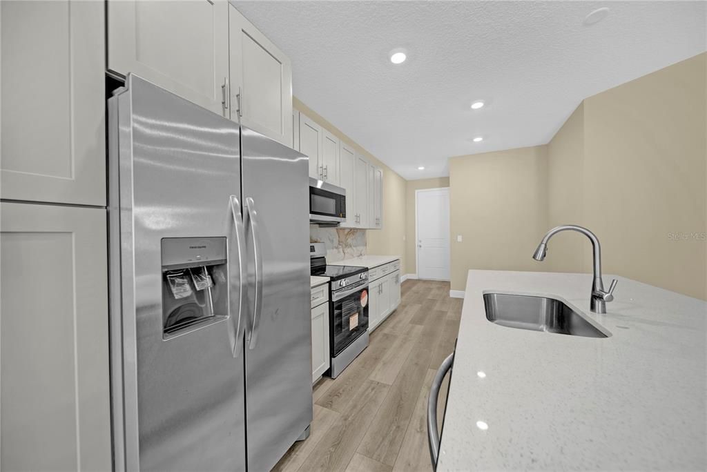 Interior, Kitchen, Recessed Lighting, Stainless Steel Appliances, Wood Texture Flooring