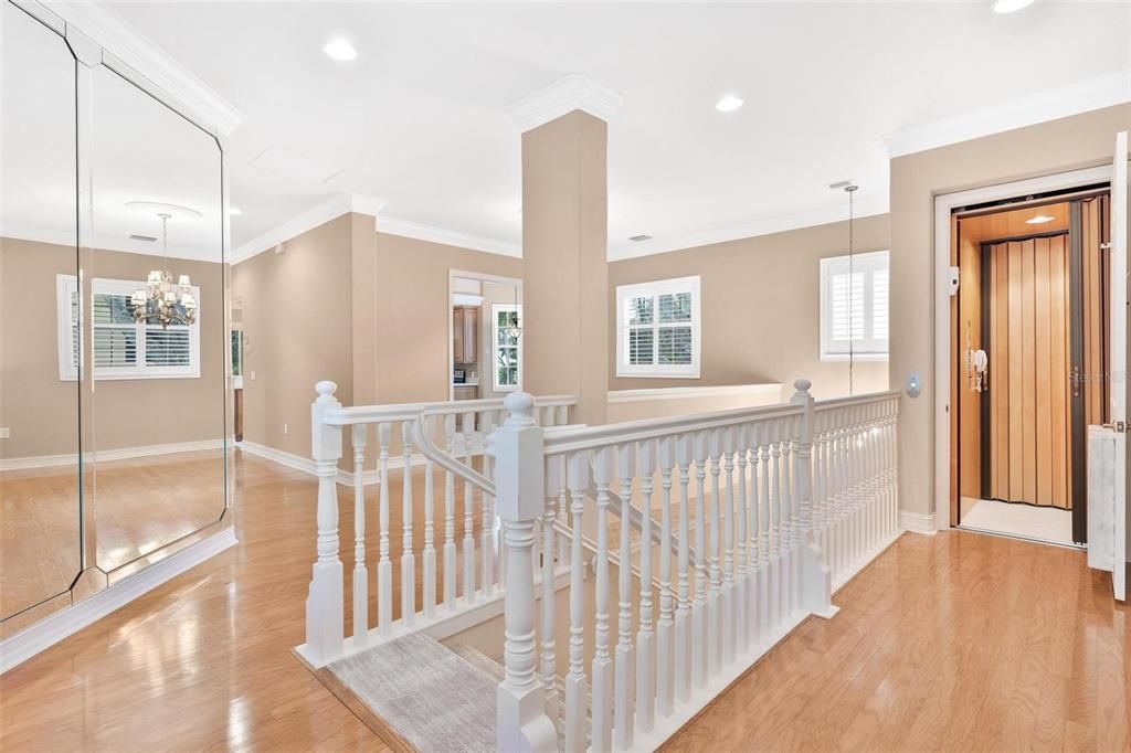 Chandelier, Elevator, Interior, Recessed Lighting, Wood Texture Flooring