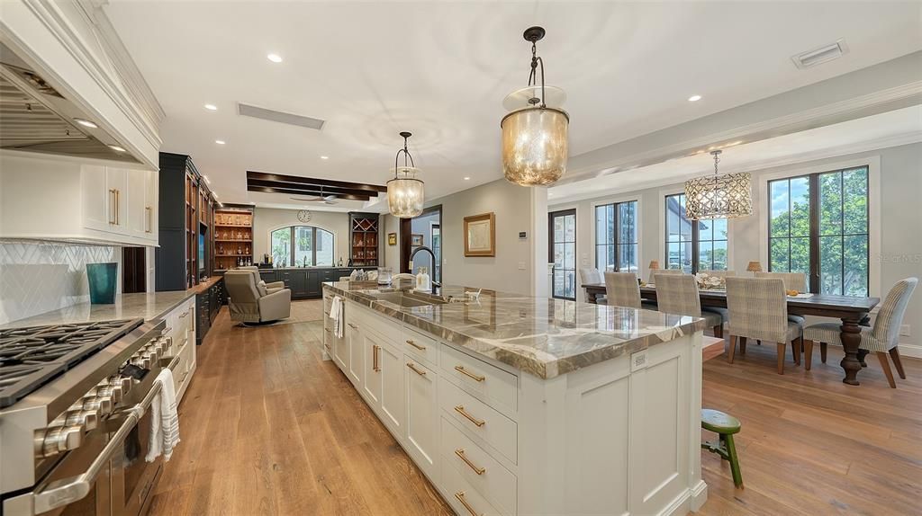 Chandelier, Dining room, Interior, Kitchen, Living room, Pendant Lights, Recessed Lighting, Stainless Steel Appliances, Wood Texture Flooring